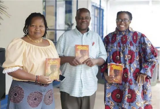  ?? ?? Left to right: Authors Samantha Vazhure, Memory Chirere and Tsitsi Ngwenya hold a copy of the book Zala Abantu Ziyebantwi­ni by Ngwenya.