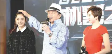  ?? — Reuters photo ?? Jackie teases ‘Bleeding Steel’ co-star Nana Ou-Yang during a press conference in Sydney in July 2016. On the right is cast member Erica Xia-Hou.