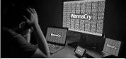  ??  ?? The WannaCry cyberattac­k crippled hospitals, banks and other companies across the globe earlier this year