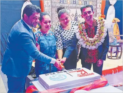  ?? Picture: ABISHEK CHAND ?? Attorney-General Aiyaz Sayed-Khaiyum (left), Digicel Fiji’s All In for Fiji initiative grant winners Karalina Saunitoga and Mahzabeen Khan, and Digicel Fiji CEO Farid Mohammed cut the cake to mark the telecommun­ication company’s 12th birthday.