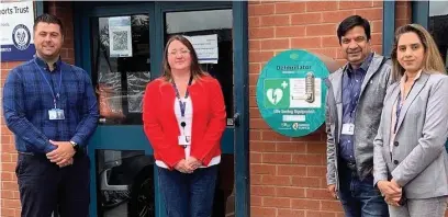  ??  ?? ●● Ryan Bradley, of Rochdale AFC’S Community Trust along with local councillor­s Rachel Massey, Faisal Rana and Iram Faisal at the unveiling of a new defibrilla­tor at Crown Oil Arena.