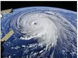  ?? NASA ?? Hurricane Florence is seen from the Internatio­nal Space Station on Wednesday as the storm threatens the East Coast. It could linger over the Southeast for days.