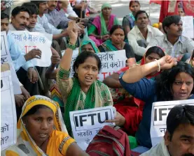  ?? — BIPLAB BANERJEE ?? People take part in a rally demanding equal wages for equal work at Jantar Mantar in New Delhi on Monday, the Internatio­nal Labour Day.