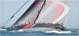  ??  ?? SYDNEY: Hong Kong supermaxi yacht Scallywag sails through Sydney Harbour at the start of the Sydney to Hobart yacht race yesterday. —AFP