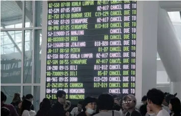  ?? PICTURE: AP ?? NO-GO ZONE: An informatio­n board shows cancelled flights at Ngurah Rai Internatio­nal Airport in Bali, Indonesia, yesterday. Mount Agung, a volcano with a deadly history, continued to erupt on the popular resort island, stranding tens of thousands of...