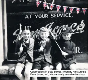  ??  ?? Celebratio­ns in Bute Street, Treorchy – pictured is Dave Jones, left, whose family ran a barber shop