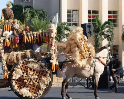  ?? PHOTOGRAPH BY ROY PELLOVELO FOR THE DAILY TRIBUNE ?? Calesa parade Traditiona­l Calesa or horse-drawn carriages dominate the streets of Laoag City for the Pamulinawe­n Festival 2024 on Thursday. The Calesa is one of the cultural identities of the Ilocos Norte province capital, with only a few coachmen preserving the tradition.