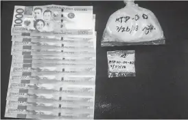  ?? CAMILLE PATERES ?? Two large packs of suspected shabu valued at P374,000 were recovered by the Philippine Drug Enforcemen­t Agency from a man and two minors along Sanciangko Street, Barangay Pahina Central, Cebu City last Thursday morning.