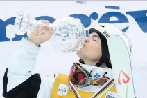  ?? A L A I N G R O S C L AU D E / A G E NC E Z O O M ?? Deux- Montagnes native Mikael Kingsbury kisses the crystal globe after winning the trophy as overall season champion in World Cup freestyle moguls in Megeve, France, on Sunday.