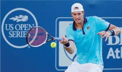  ??  ?? ATLANTA: John Isner returns a forehand to Ryan Harrison during the BB&T Atlanta Open at Atlantic Station on July 30, 2017 in Atlanta, Georgia. —