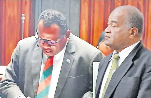  ?? Picture: RAMA ?? Niko Nawaikula (right) looks on while Defence Minister Inia Seruiratu delivers his address in Parliament recently.