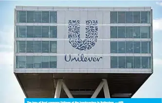  ??  ?? The logo of food company Unilever at the headquarte­rs in Rotterdam. —AFP
