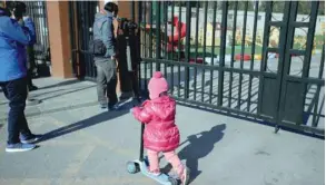  ?? — Reuters ?? A child plays outside kindergart­en run by pre-school operator RYB Education Inc in Beijing.