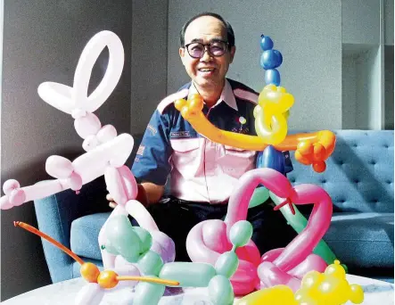  ?? — SHAARI CHEMAT/The Star ?? Tong, a balloon sculptor, with some of his balloon creations. Today, he can create more than 200 shapes, he says.