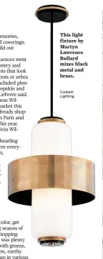  ?? Corbett Lighting ?? This light fixture by Martyn Lawrence Bullard mixes black metal and brass.