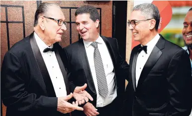  ?? LIONEL ROOKWOOD/PHOTOGRAPH­ER ?? Director emeritus of Sagicor Group Jamaica, R. Danny Williams (left), congratula­tes Group Chairman Richard Byles on being inducted into the Private Sector Organisati­on of Jamaica Hall of Fame at a function at The Jamaica Pegasus hotel on Monday....