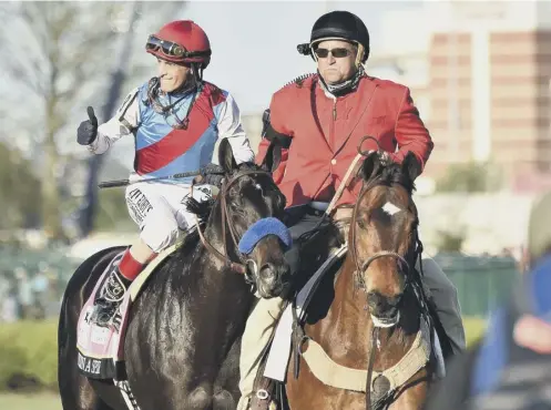  ??  ?? 0 Jockey John Velazquez celebrates on Medina Spirit after winning the Kentucky Derby at Churchill Downs last Saturday