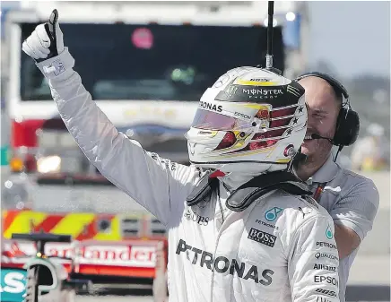  ?? — THE ASSOCIATED PRESS ?? Mercedes driver Lewis Hamilton gives the thumbs up Saturday after winning the pole for the Formula One U.S. Grand Prix at the Circuit of the Americas in Austin.