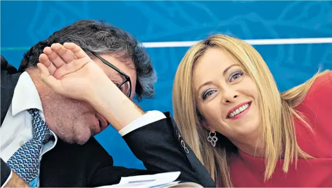  ?? ?? Giorgia Meloni presents the budget with Giancarlo Giorgetti, the finance minister, at a press conference in Rome