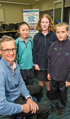  ?? NEV MADSEN PHOTO: ?? SCHOOL GROWS: Excited to check out the new library renovation­s are HNK project management officer Nathan Harmsworth with Glenvale Christian School captains (from left) Hannah Tam, Patricia Thomas and Elijah Wright.