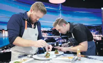  ?? GREG GAYNE / NETFLIX/VIA THE CANADIAN PRESS ?? Chefs Timothy Hollingswo­rth and Darren MacLean dress their plates in a scene from The Final Table. MacLean is the only Canadian contender on the show.