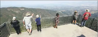  ?? PATRICK TEHAN — STAFF FILE ?? Visitors take in the view after the opening ceremony for the new public space atop Mount Umunhum, a 3,486-foot peak near San Jose.