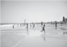  ?? MEGAN RAYMOND ?? The Ocean City Town Council unanimousl­y passed an ordinance to prohibit women from going topless at the beach.