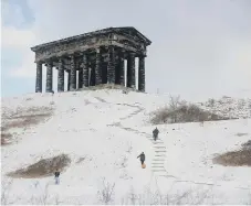  ??  ?? Hardy souls head up to Penshaw Monument through the snow.