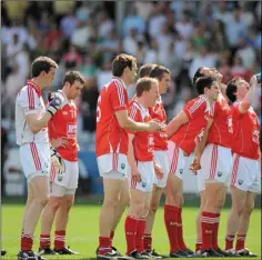  ??  ?? The Louth players prepare for the national anthem prior to the Longford game.