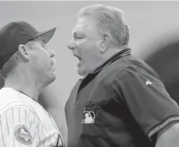  ?? ASSOCIATED PRESS FILE PHOTO ?? Astros manager Phil Garner, left, gets into it with home plate umpire Rick Reed and is thrown out of a 2006 game against the Pittsburgh Pirates in Houston. Reed, whose career as a big league umpire spanned three decades and included two All-Star games and a World Series, has died. He was 70.