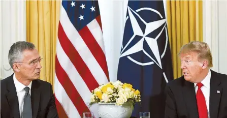  ?? Reuters-Yonhap ?? U.S. President Donald Trump speaks during a meeting with NATO Secretary General Jens Stoltenber­g at Winfield House in London, Tuesday.