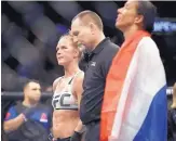  ?? FRANK FRANKLIN II/ ASSOCIATED PRESS ?? Holly Holm, left, waits for a decision after Saturday’s bout against Germaine de Randamie, right. Holm lost by unanimous decision but is appealing the controvers­ial result.