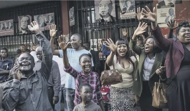 ?? PICTURE; GETTY IMAGES ?? 0 Nelson Chamisa supporters celebrate in the street outside their headquarte­rs in Harare even though the election result had not been announced