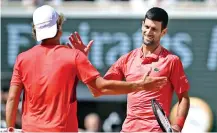  ?? ?? Novak Djokovic greets Aleksandar Kovacevic after his win