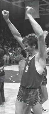  ??  ?? FRIEND AT COURT: USSR player Ivan Edeshko raises his arms after teammate Alexander Belov scored a ‘second chance’ basket, right.