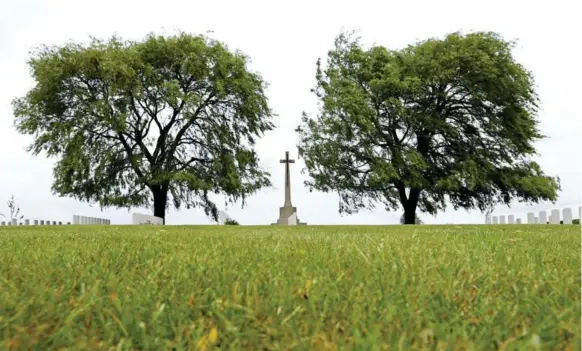  ?? RICHARD LAUTENS/TORONTO STAR ?? Alan Mather is now buried in the cemetery at Prowse Point, near Ploegsteer­t. Three generation­s of his Australian family came for the military funeral in 2010.