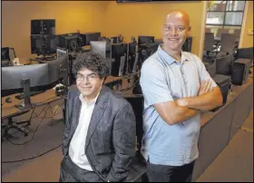  ?? K.M. Cannon Las Vegas Review-Journal @KMCannonPh­oto ?? Ed Miller, left, and Matthew Davidow, co-founders of in-play betting company Deck Prism Sports, at their Henderson office.