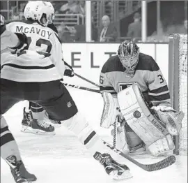  ?? Mark J. Terrill Associated Press ?? KINGS GOALTENDER Jack Campbell stops a shot by Boston Bruins defenseman Charlie McAvoy, who scored the go-ahead goal late in the third period.