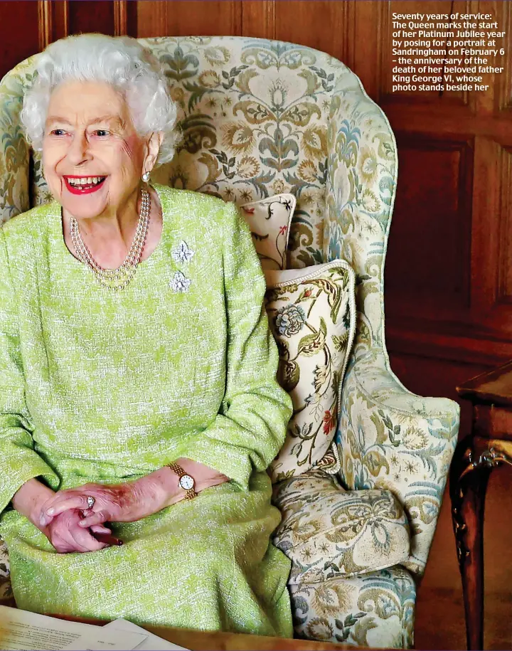  ?? ?? Seventy years of service: The Queen marks the start of her Platinum Jubilee year by posing for a portrait at Sandringha­m on February 6 – the anniversar­y of the death of her beloved father King George VI, whose photo stands beside her