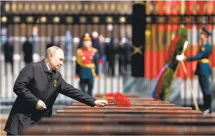  ?? ANTON NOVODEREZH­KIN AP ?? Russian President Vladimir Putin attends a wreath-laying ceremony at the Tomb of the Unknown Soldier after a military parade in Moscow’s Red Square marking the 77th anniversar­y of the end of World War II on Monday.