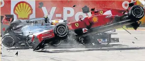  ??  ?? FENDER BENDER: Fernando Alonso (front) and Lewis Hamilton (rear) collide during the Belgian Grand Prix in 2012