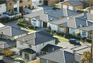  ?? Bloomberg ?? Mt Wellington suburb in Auckland. A bill placing limitation­s on foreigners purchasing homes passed its final reading in parliament yesterday in Wellington.