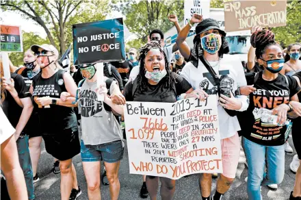  ?? NATASHA MOUSTACHE/GETTY ?? Protesters take to the streets after the March on Washington on Friday. Participan­ts rallied against many of the same issues at play in the 1963 march.