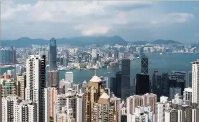  ?? BILLY H.C. KWOK / BLOOMBERG ?? Hong Kong is projected to record its fastest economic growth rate since 2011, but whether such a trend can be sustained is up for debate as slower world trade in 2018 could hurt Asia more than other regions, according to economists.