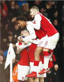  ??  ?? Arsenal’s Granit Xhaka celebrates scoring their second goal with team-mates