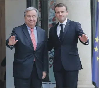  ?? AP ?? UN Secretary General Antonio Guterres, left, is welcomed by French President Emmanuel Macron. The Paris Peace Forum was launched on the 100th anniversar­y of Armistice Day