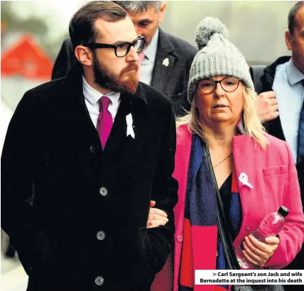  ??  ?? &gt; Carl Sargeant’s son Jack and wife Bernadette at the inquest into his death