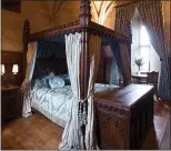  ??  ?? SUMPTUOUS: The four-poster bed in one of the suites at Warwick Castle