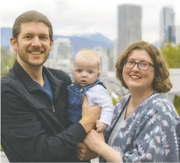  ?? FRANCIS GEORGIAN ?? Dave and Natalie Daniels hold their four-month-old son Ronin, who was born to a surrogate after the couple tried for years to have a baby.