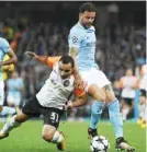  ??  ?? MANCHESTER: Manchester City’s English defender Kyle Walker (R) clashes with Shakhtar Donetsk’s Brazilian defender Ismaily during the Group F football match between Manchester City and Shakhtar Donetsk yesterday. — AFP